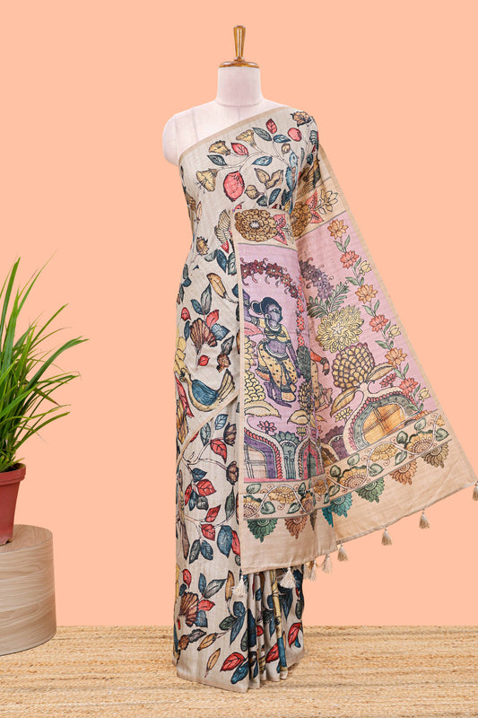 Borderless beige art tussar saree with tree, bird motifs and dancing girl printed pallu