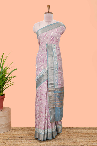 Peach assam silk saree with geometric print body, contrast zari border, and zari stripe pallu