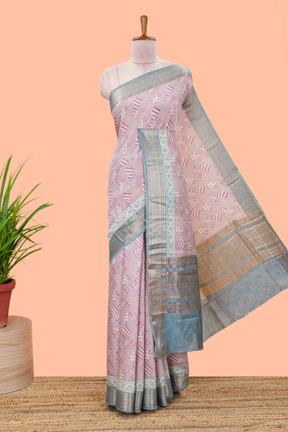 Peach assam silk saree with geometric print body, contrast zari border, and zari stripe pallu