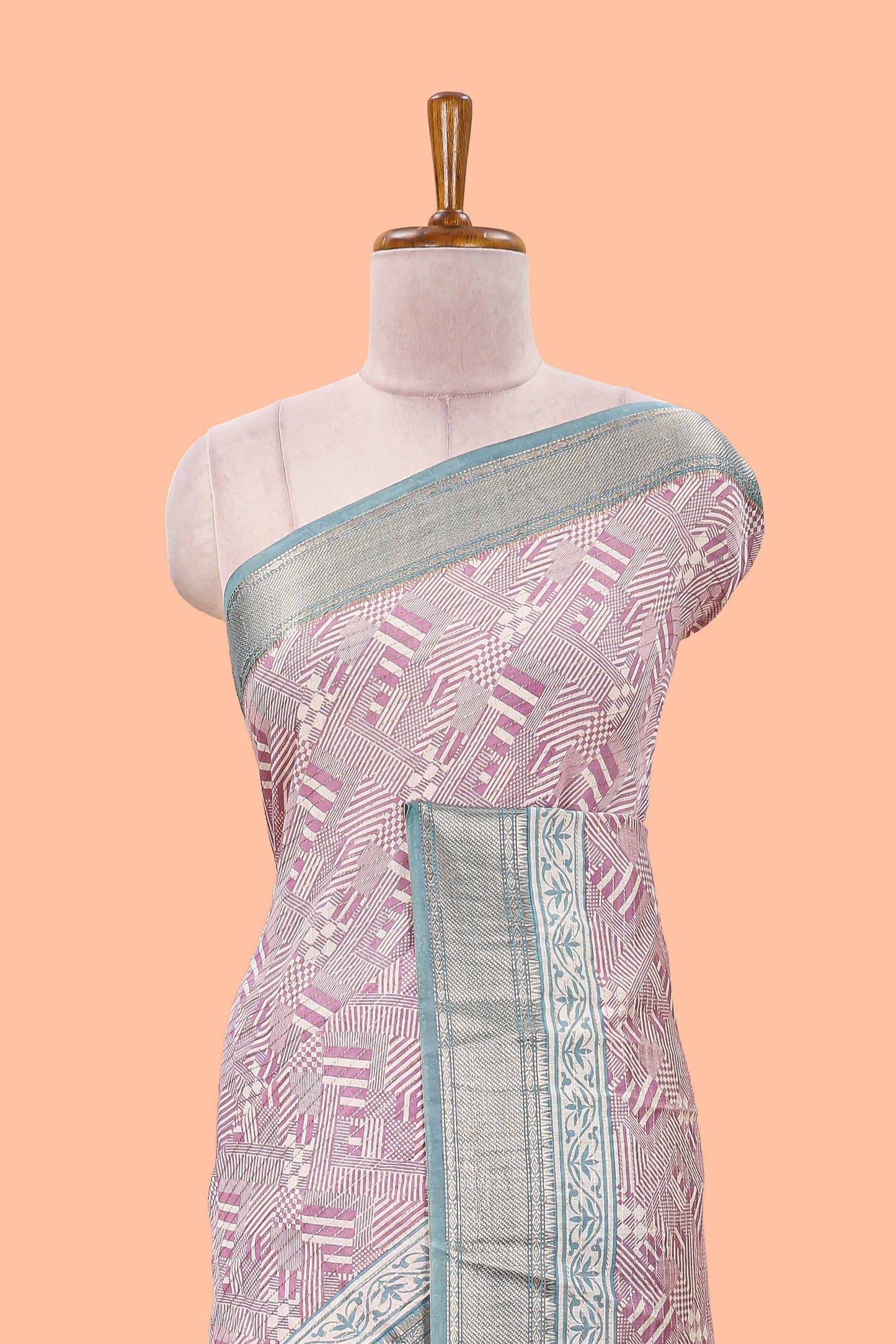 Peach assam silk saree with geometric print body, contrast zari border, and zari stripe pallu