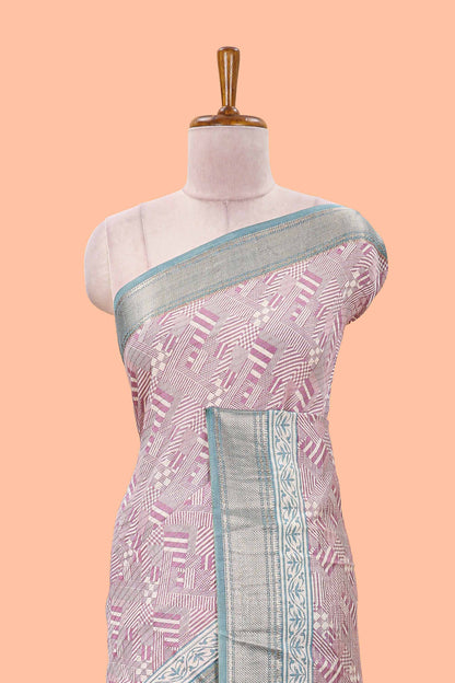Peach assam silk saree with geometric print body, contrast zari border, and zari stripe pallu