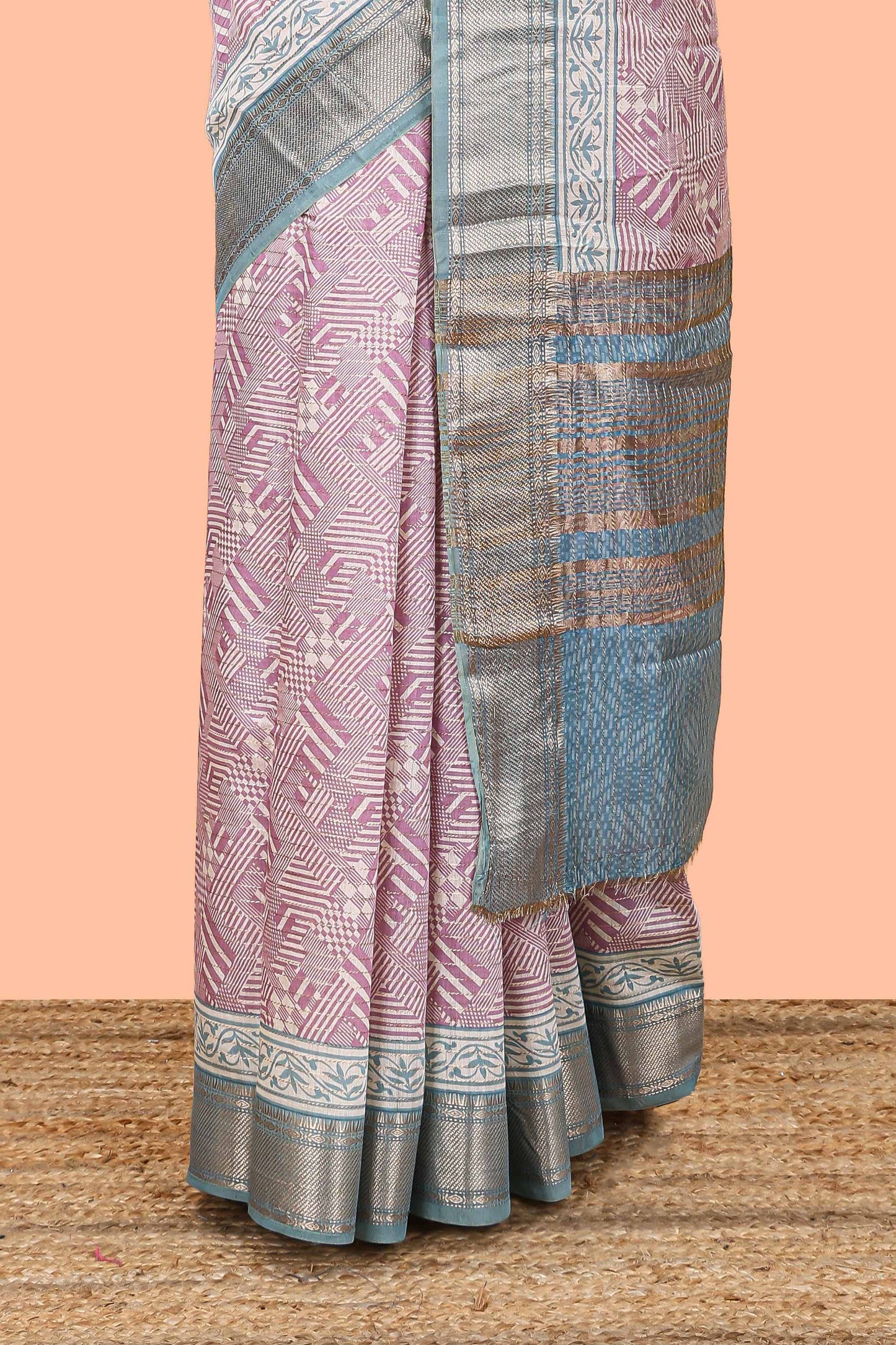 Peach assam silk saree with geometric print body, contrast zari border, and zari stripe pallu