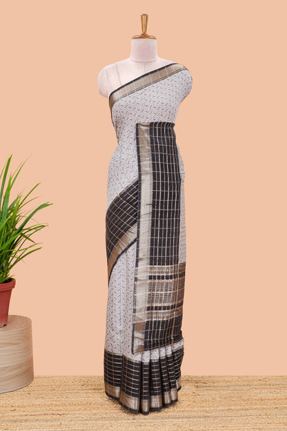 Grey assam silk saree with geometric print, contrast border with zari checks, and Pallu