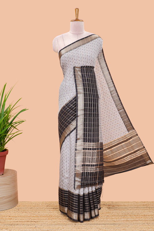 Grey assam silk saree with geometric print, contrast border with zari checks, and Pallu