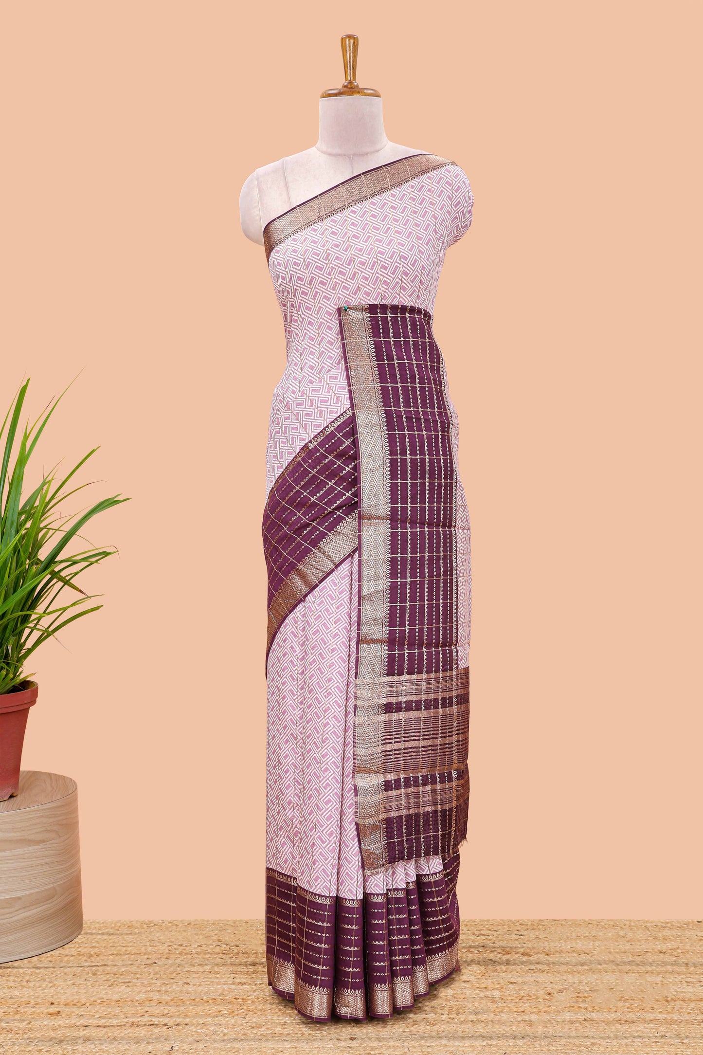 Purple assam silk saree with geometric print, contrast border with zari checks, and Pallu