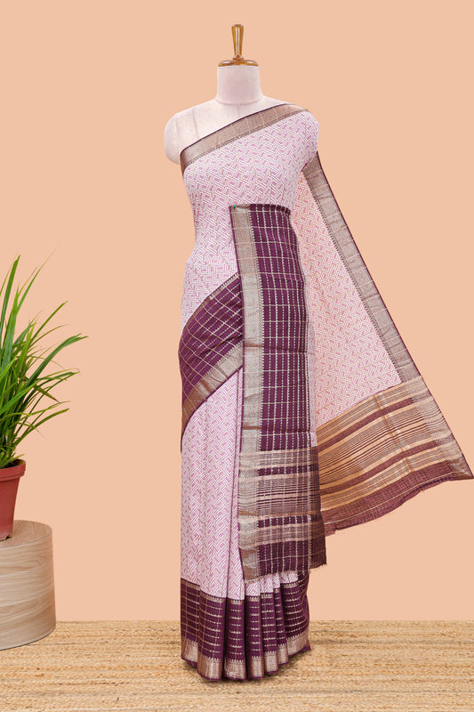 Purple assam silk saree with geometric print, contrast border with zari checks, and Pallu