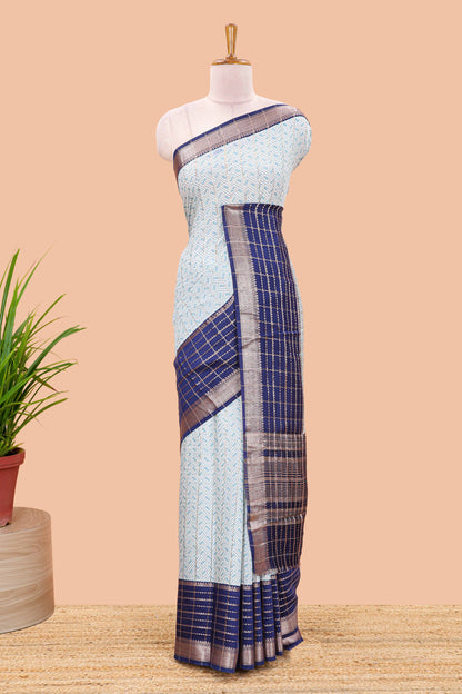 Turquiose blue assam silk saree with geometric print, contrast border with zari checks, and Pallu