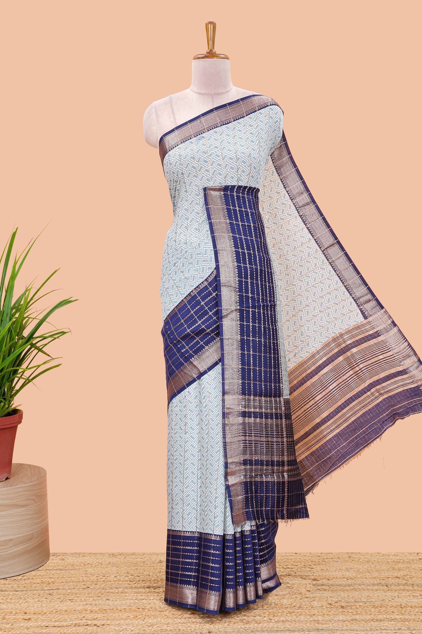 Turquiose blue assam silk saree with geometric print, contrast border with zari checks, and Pallu