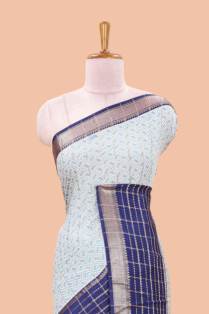 Turquiose blue assam silk saree with geometric print, contrast border with zari checks, and Pallu