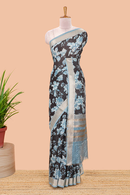 Black assam silk saree with vertical zari lines, blue floral print and zari stripe pallu