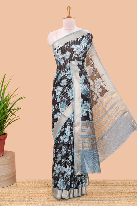 Black assam silk saree with vertical zari lines, blue floral print and zari stripe pallu