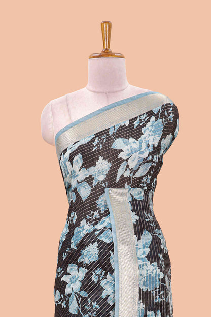 Black assam silk saree with vertical zari lines, blue floral print and zari stripe pallu