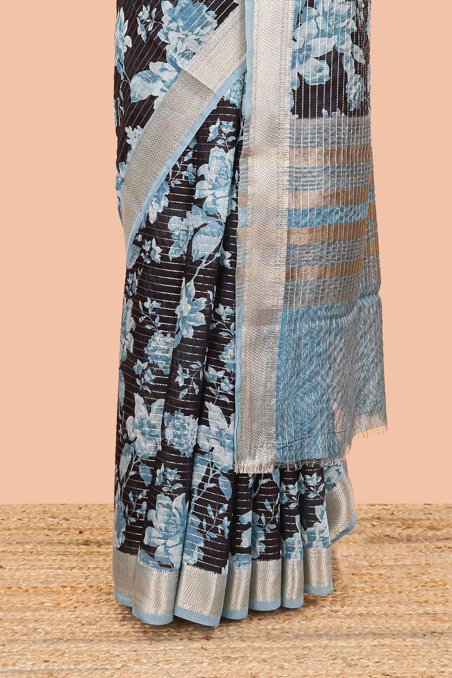 Black assam silk saree with vertical zari lines, blue floral print and zari stripe pallu