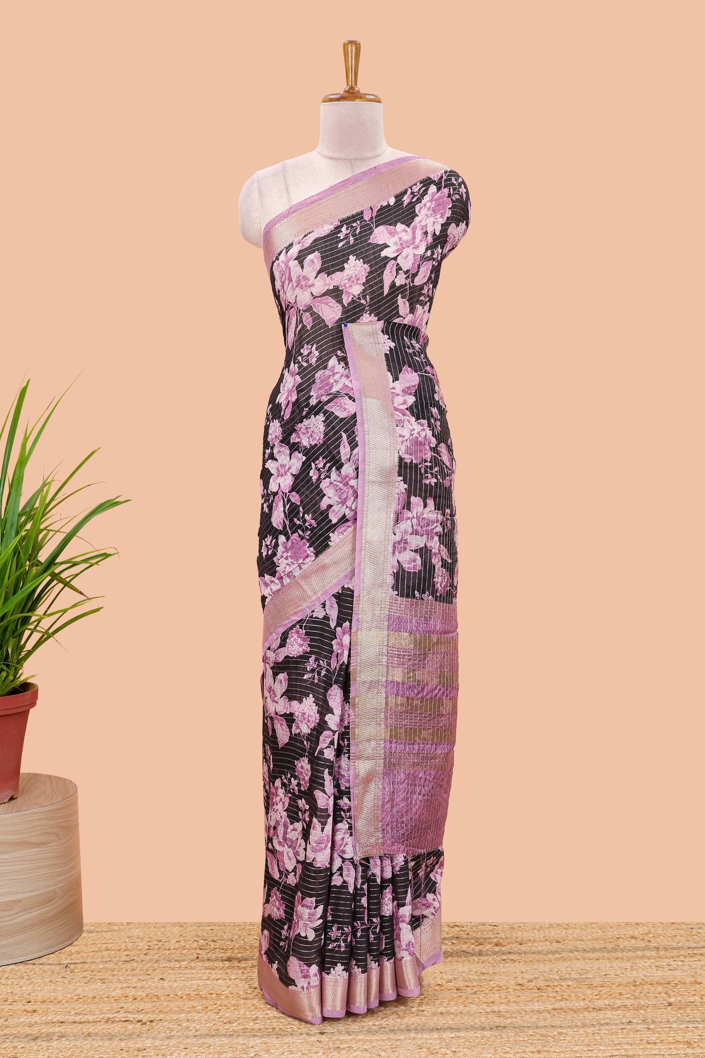 Balck assam silk saree with vertical zari lines, pink floral print and zari stripe pallu