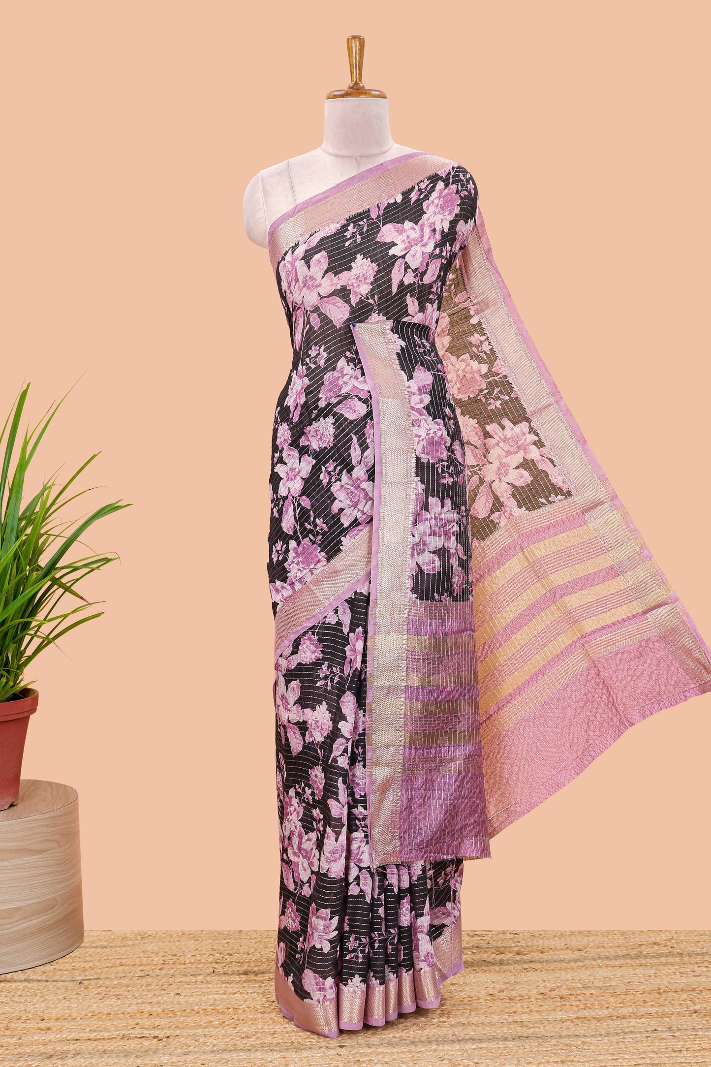 Balck assam silk saree with vertical zari lines, pink floral print and zari stripe pallu