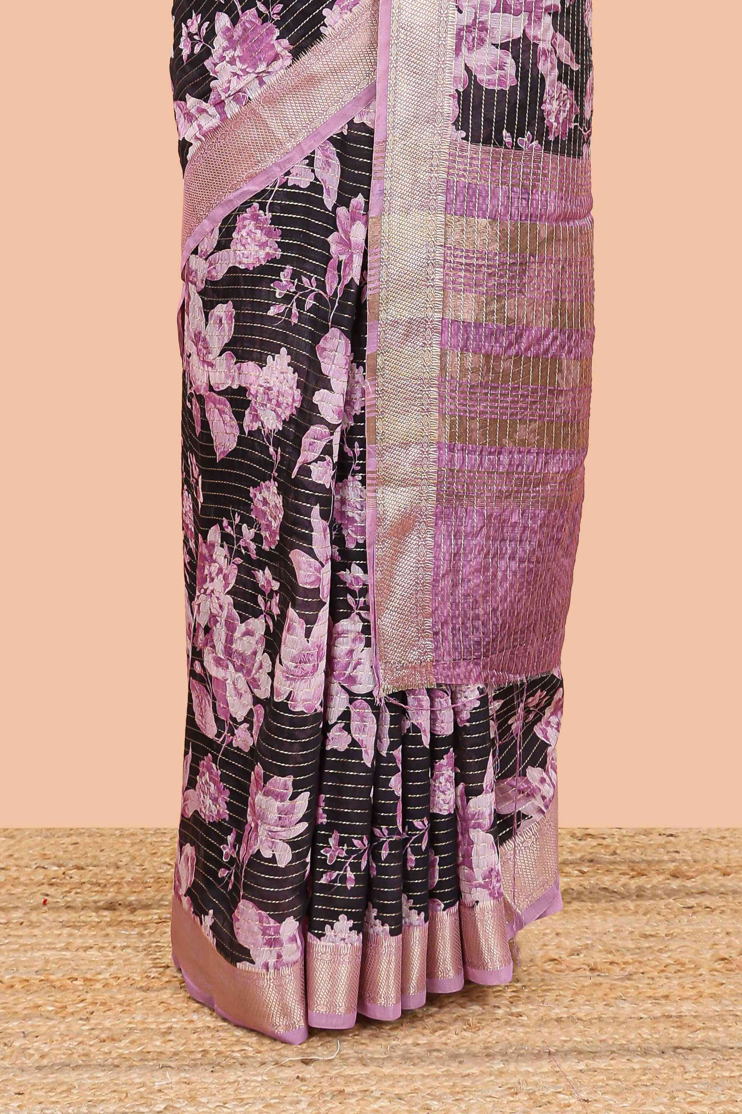 Balck assam silk saree with vertical zari lines, pink floral print and zari stripe pallu