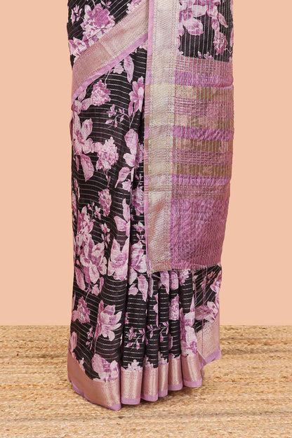 Balck assam silk saree with vertical zari lines, pink floral print and zari stripe pallu