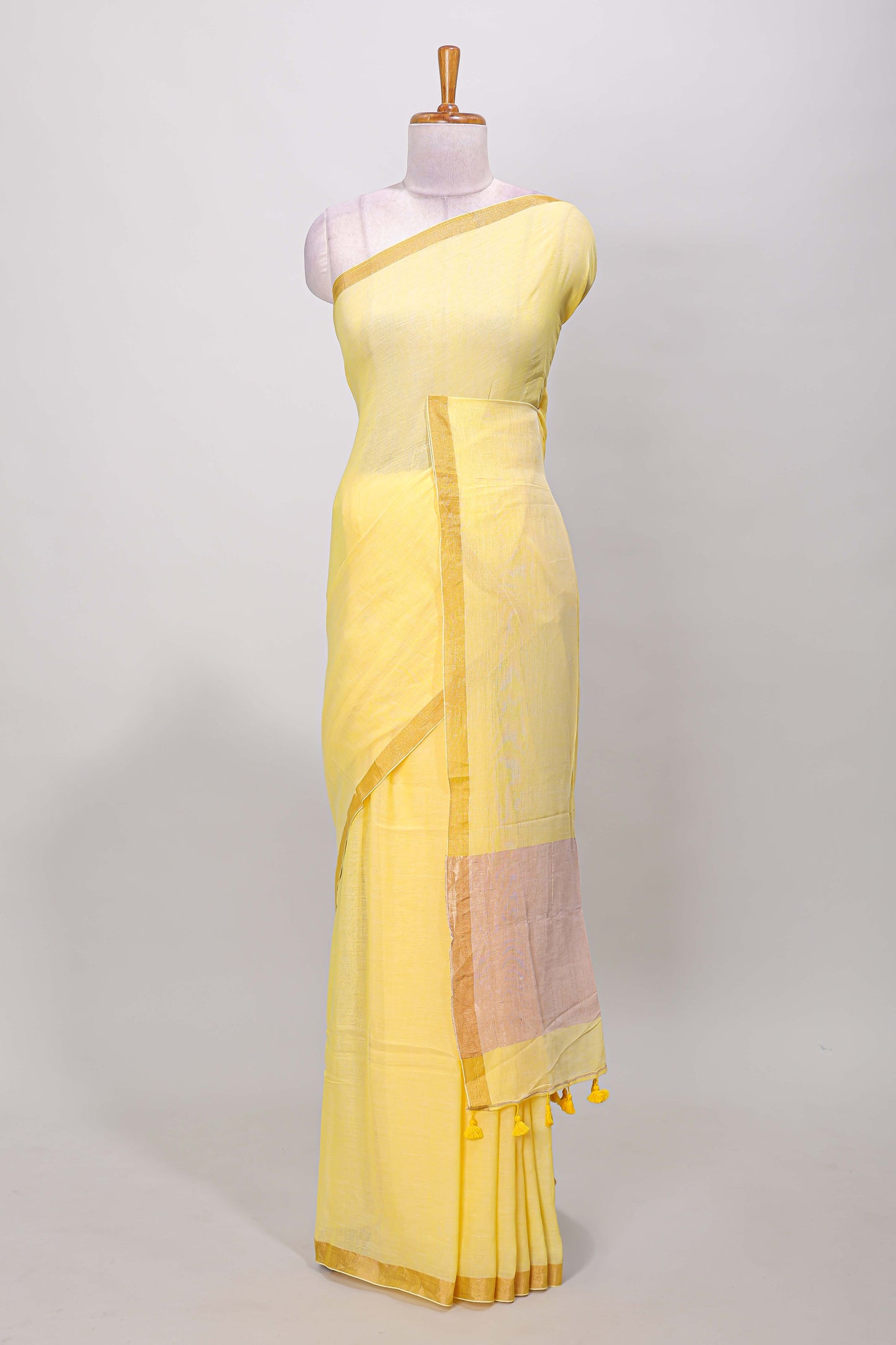 Yellow plain south cotton saree with zari border and pallu