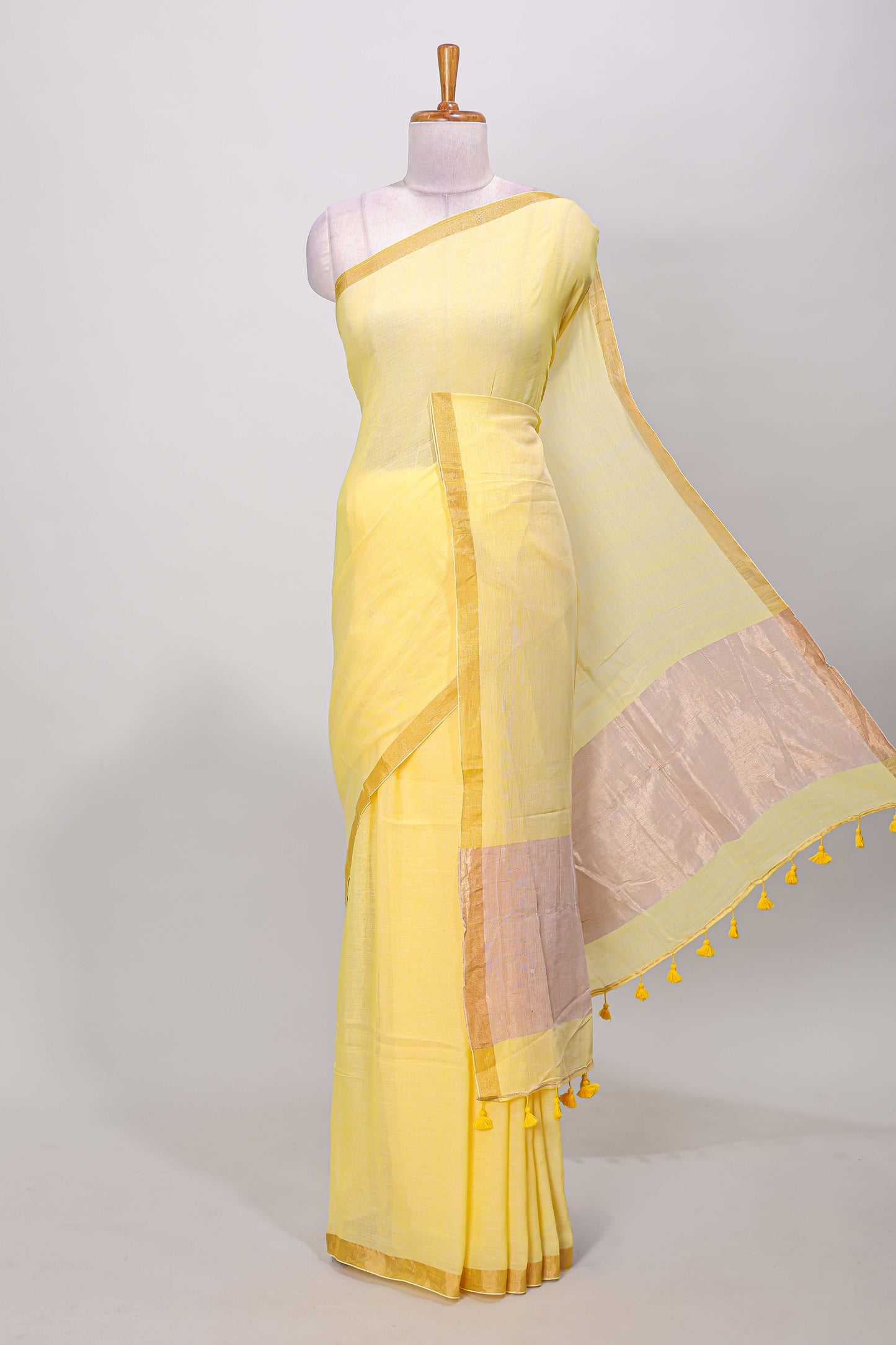 Yellow plain south cotton saree with zari border and pallu