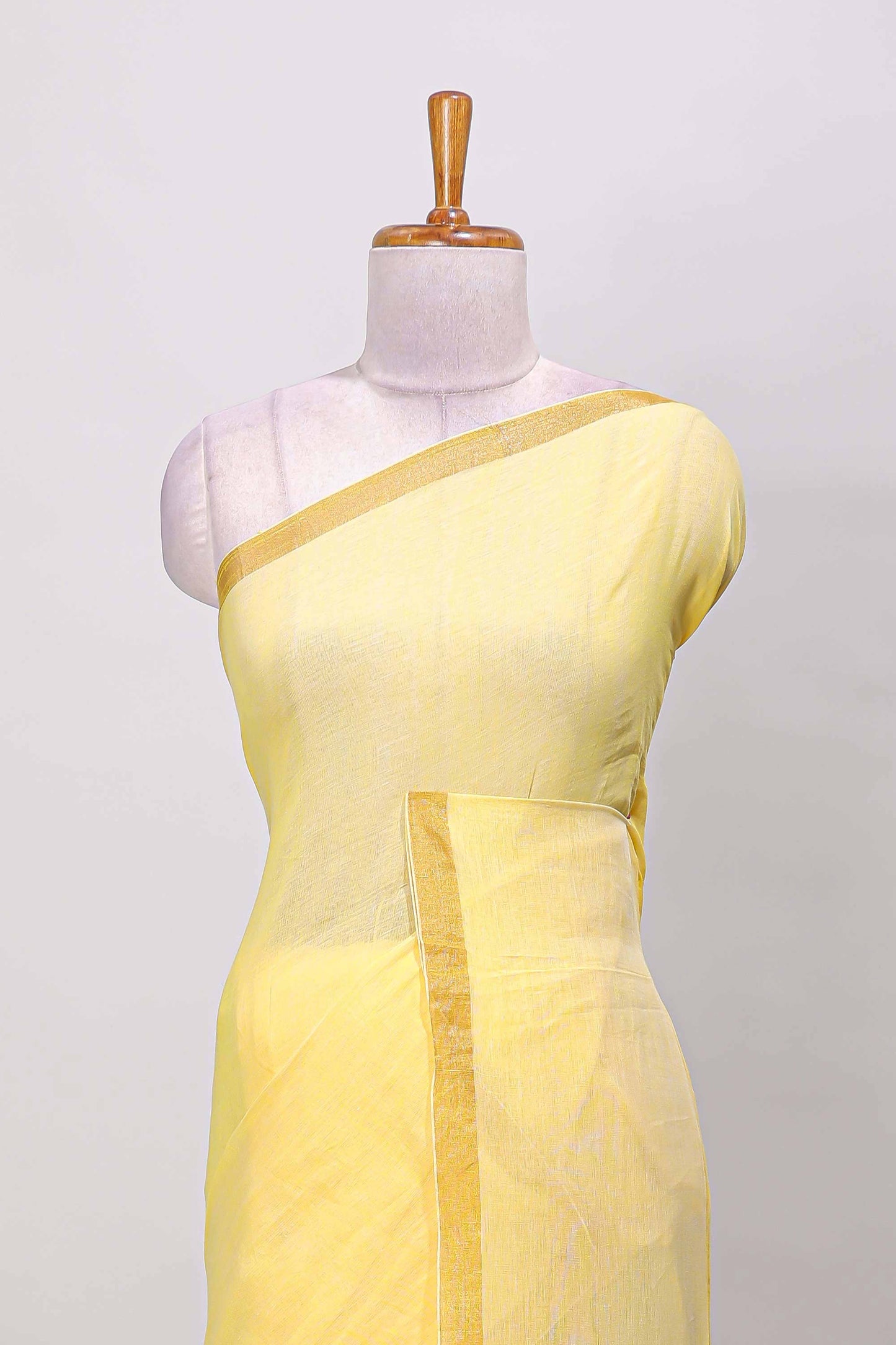 Yellow plain south cotton saree with zari border and pallu