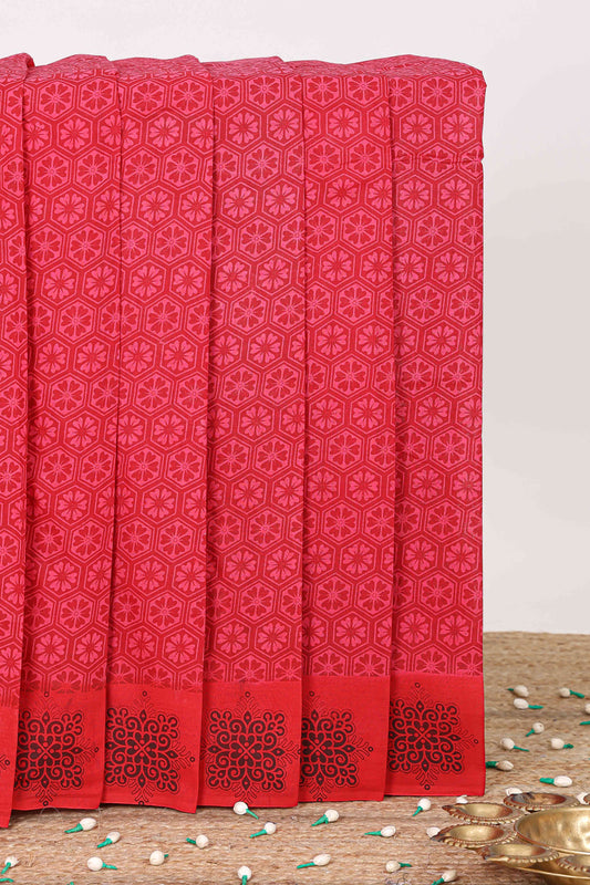 Pink floral design butta sungudi cotton saree with contrast border and floral motifs pallu