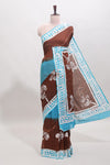 Chocolate brown and blue dual shade floral motifs mul mul cotton saree with self border and matching blouse