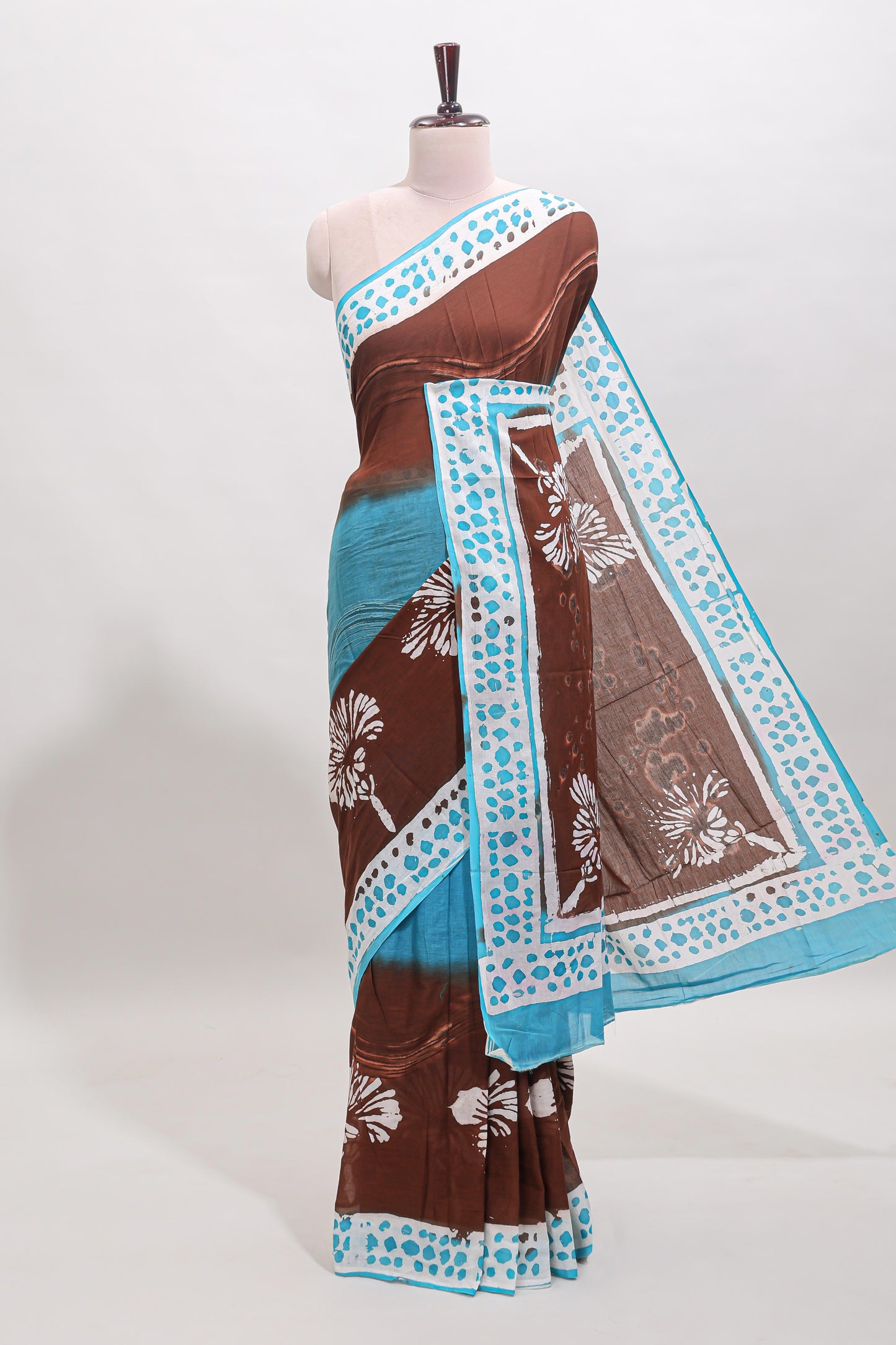 Chocolate brown and blue dual shade floral motifs mul mul cotton saree with self border and matching blouse