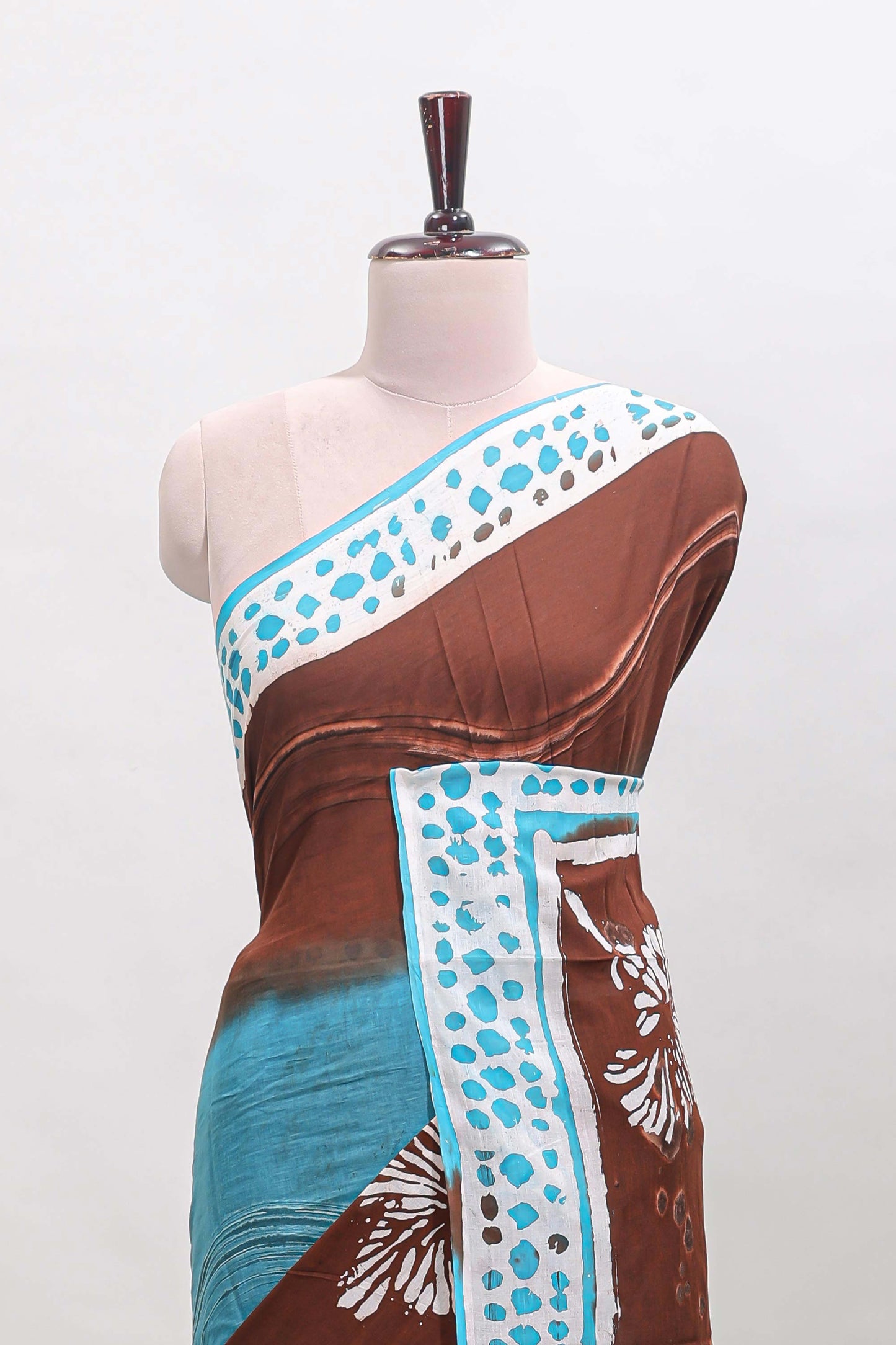 Chocolate brown and blue dual shade floral motifs mul mul cotton saree with self border and matching blouse
