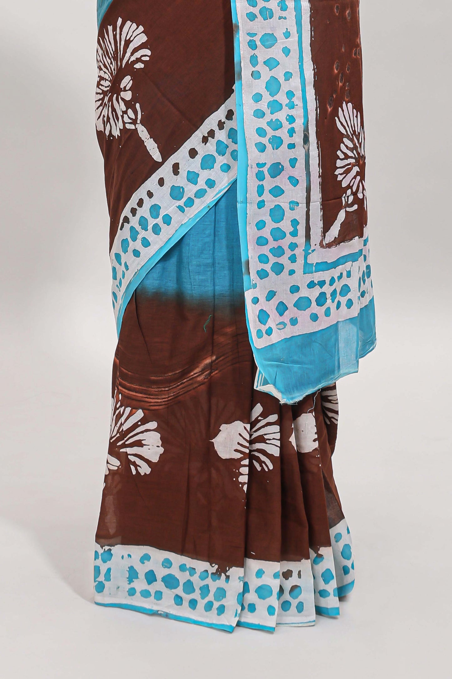 Chocolate brown and blue dual shade floral motifs mul mul cotton saree with self border and matching blouse