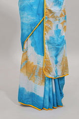 Blue shibori printed mul mul cotton saree with contrast scallop border and blouse
