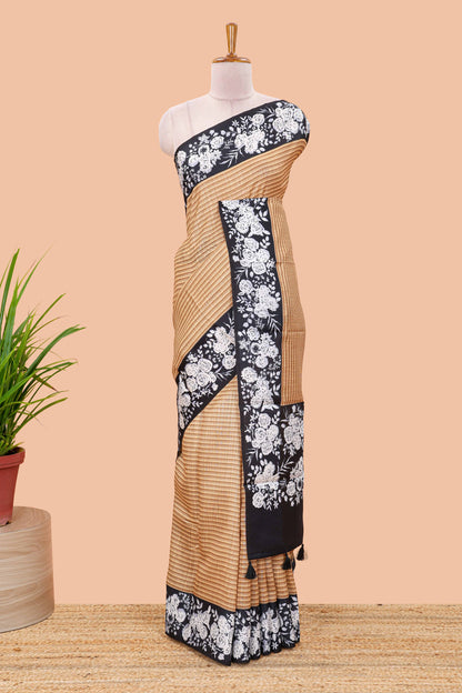 Orange linen cotton saree with all-over stripe print and black satin border with floral print pallu