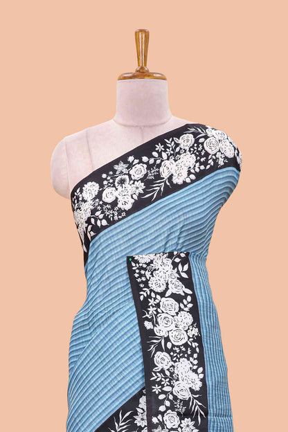 Blue linen cotton saree with all-over stripe print and black satin border with floral print pallu