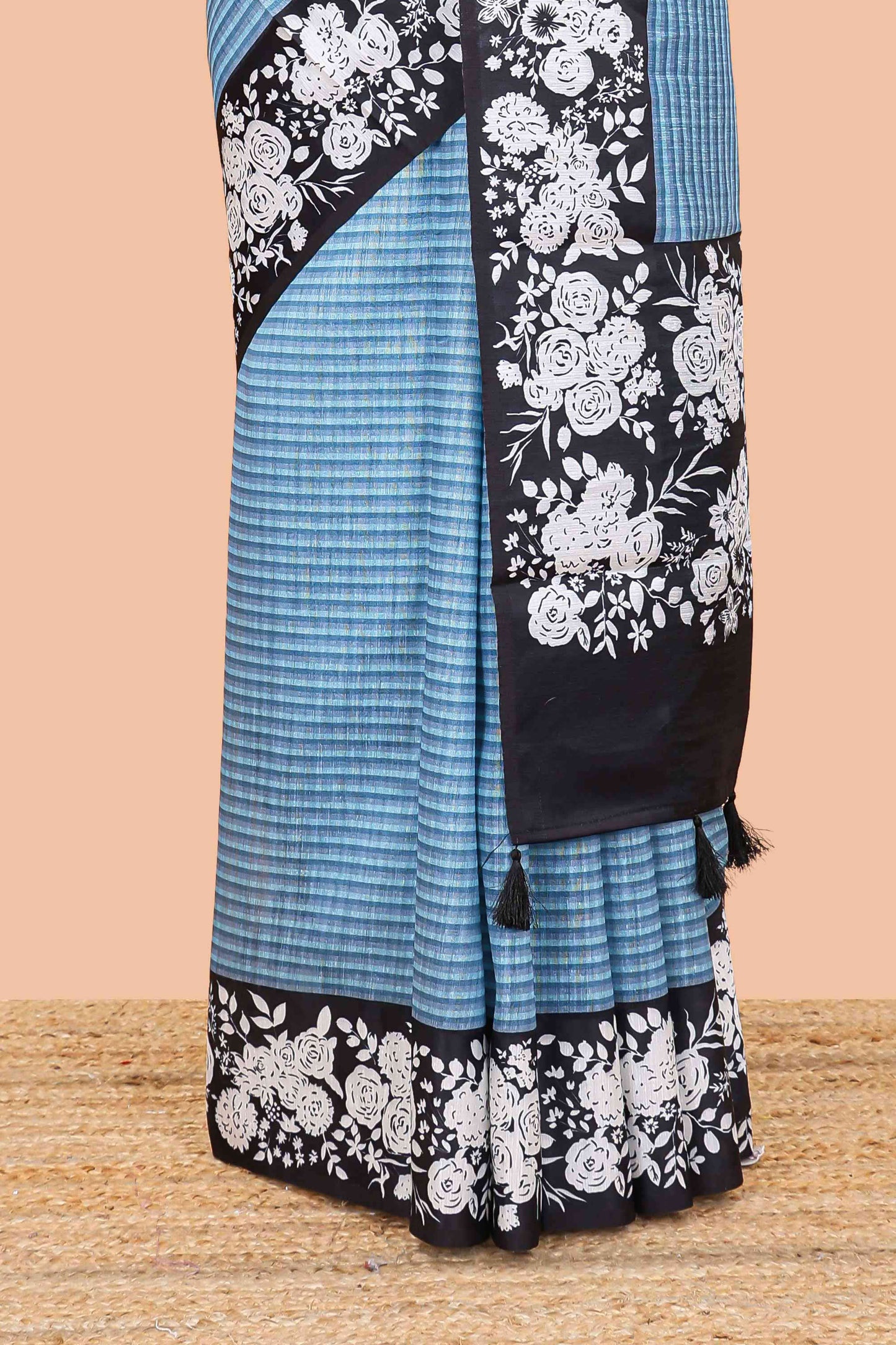 Blue linen cotton saree with all-over stripe print and black satin border with floral print pallu