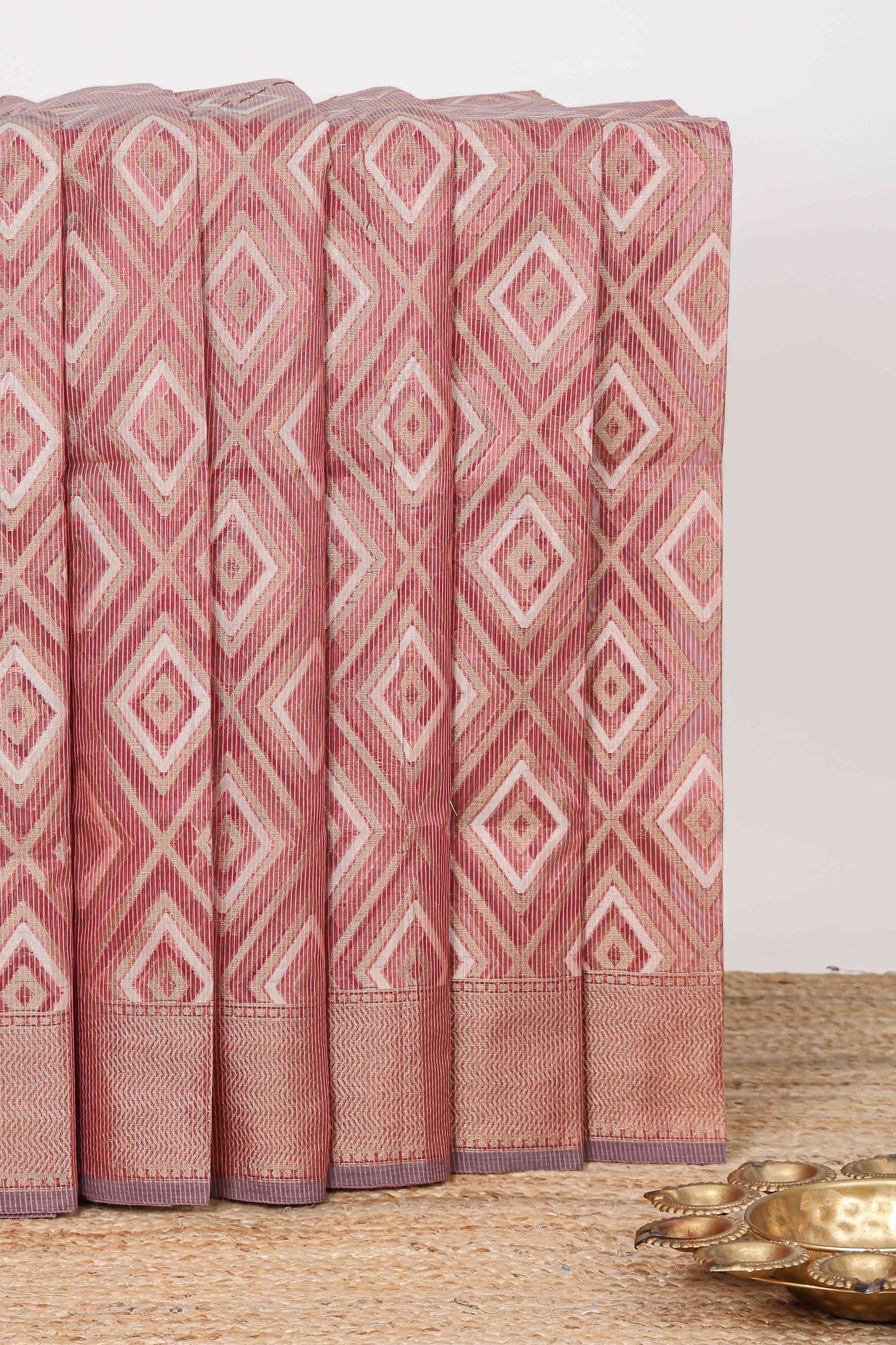 Peach geometric diamond design kota cotton saree with striped pallu and zari border