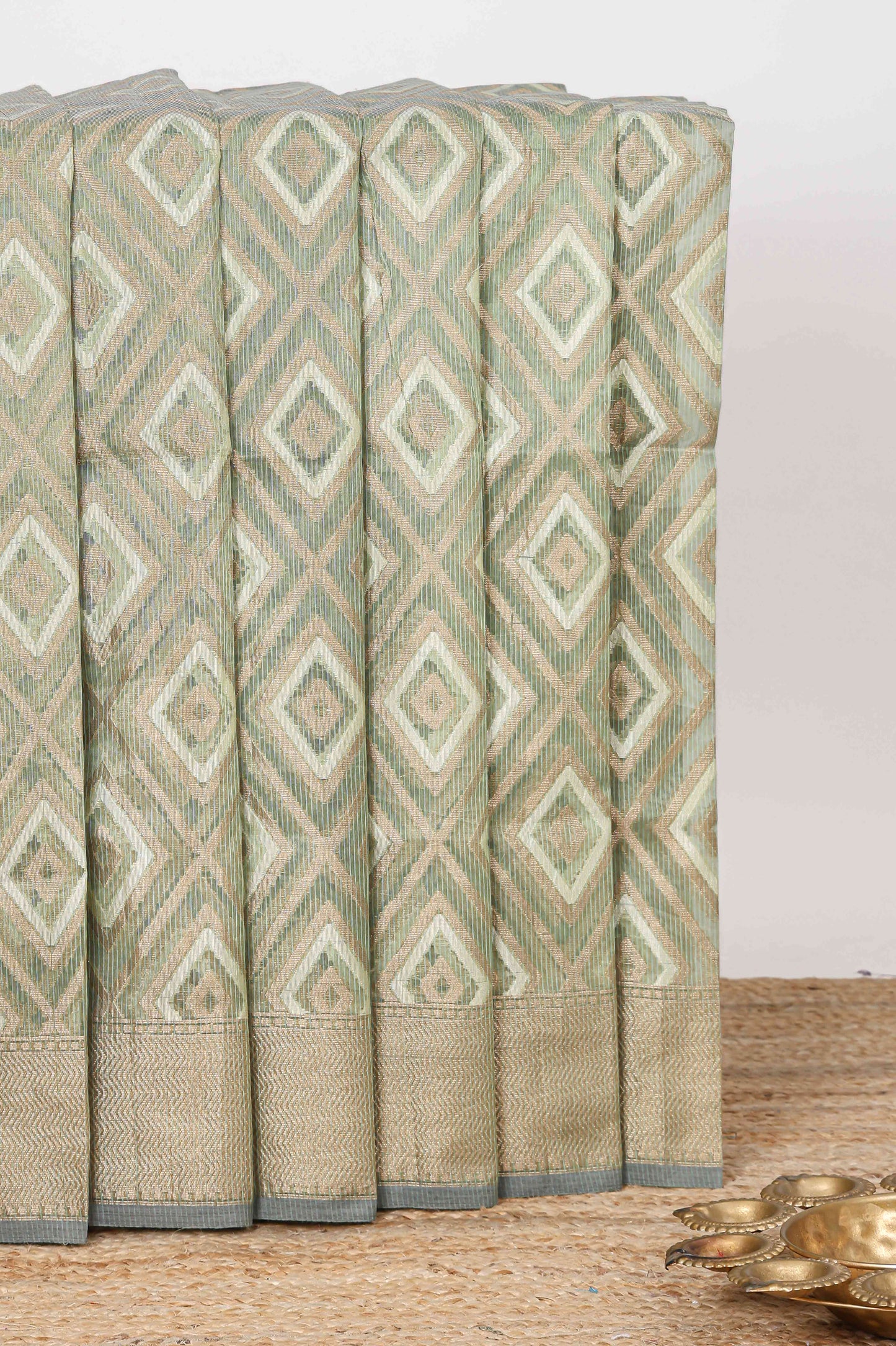 Green geometric diamond design kota cotton saree with striped pallu and zari border