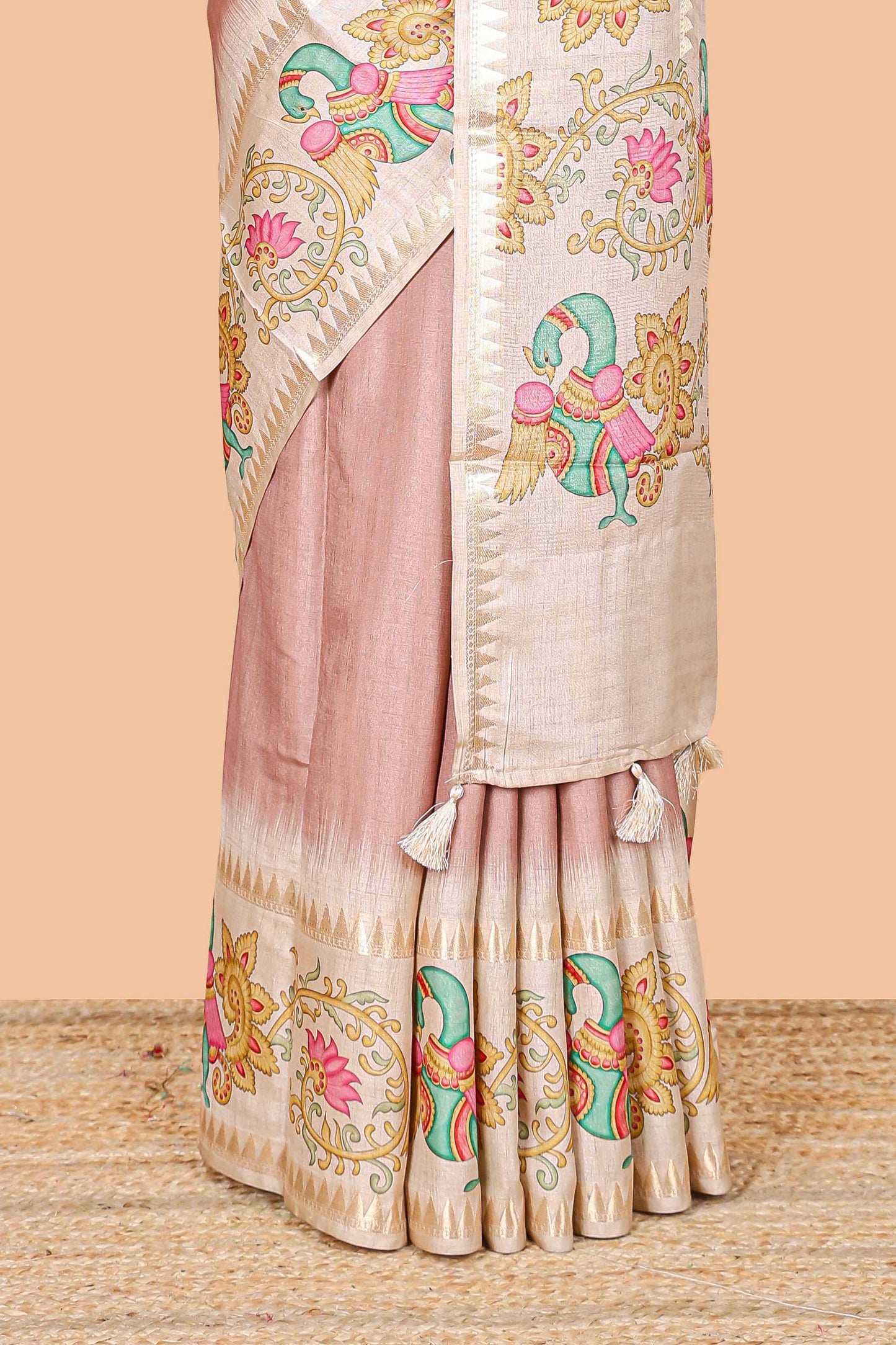 Peach plain art tussar silk saree with contrast peacock and lotus theme border and printed pallu