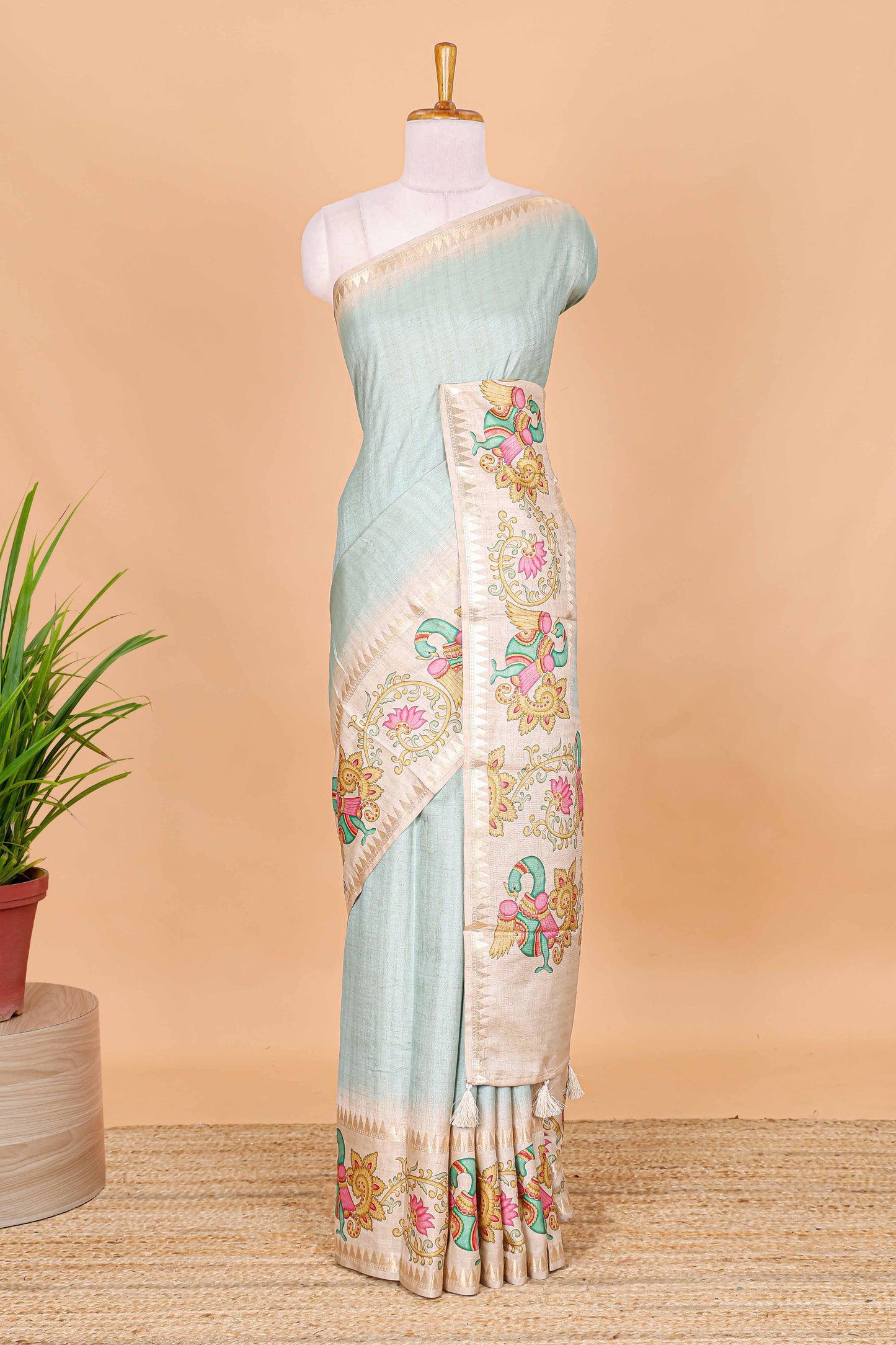 Blue plain art tussar silk saree with contrast peacock and lotus theme border and printed pallu