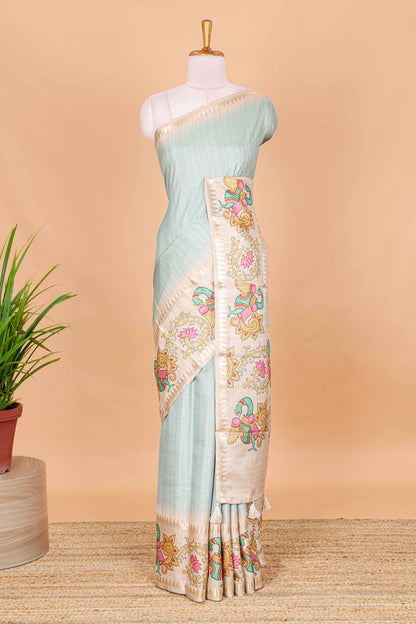 Blue plain art tussar silk saree with contrast peacock and lotus theme border and printed pallu