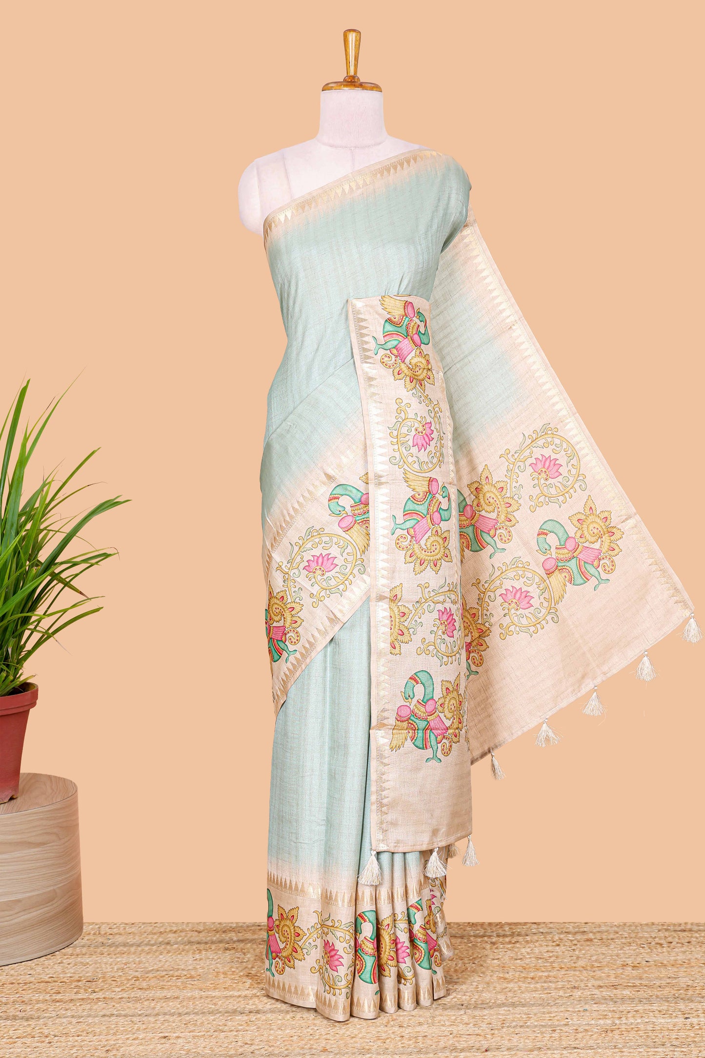 Blue plain art tussar silk saree with contrast peacock and lotus theme border and printed pallu