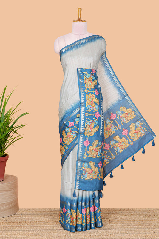 Blue plain art tussar silk saree with contrast annam bird and lotus theme border and printed pallu