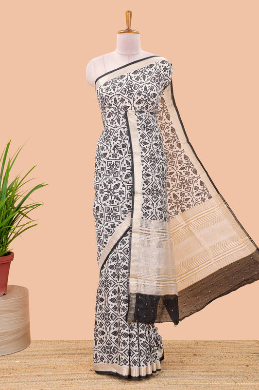 Cream assam silk saree with all over ikkat style print, contrast stripe pallu and zari border