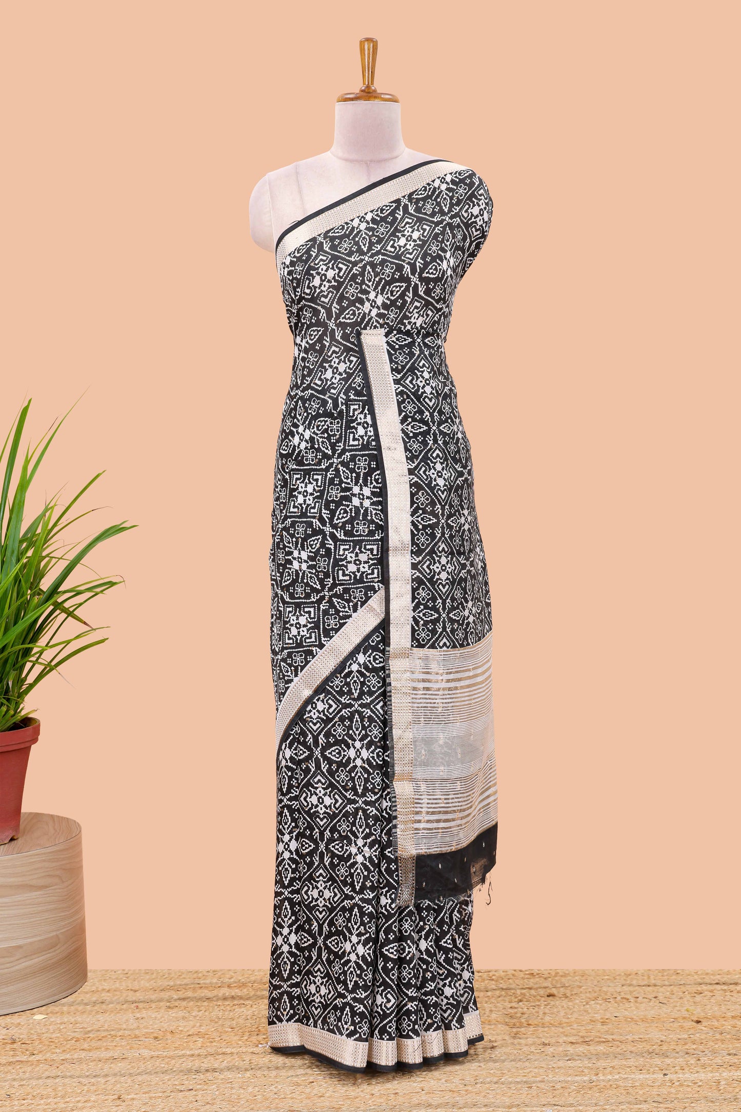 Black assam silk saree with all over ikkat style print, stripe pallu and zari border