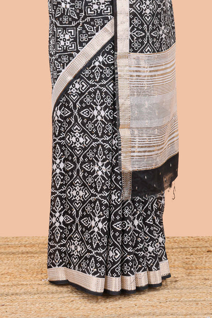 Black assam silk saree with all over ikkat style print, stripe pallu and zari border