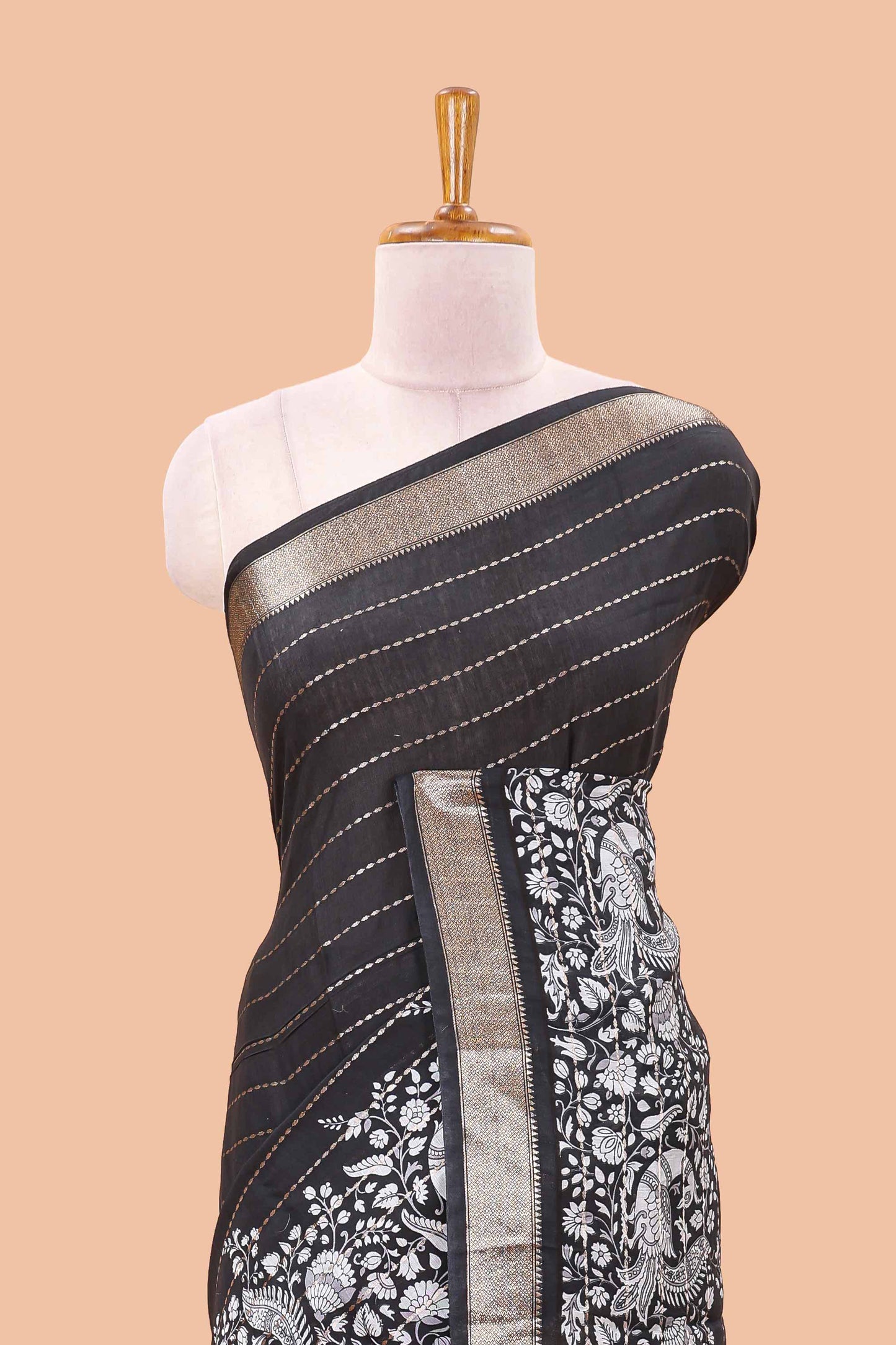 Black striped assam silk saree with kalamkari style and floral vine print, self zari border and pallu