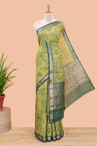 Green assam silk abstract face print saree with contrast zari border and pallu