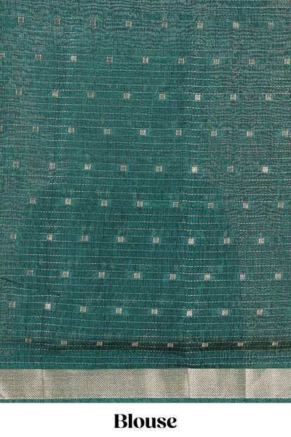 Green assam silk abstract face print saree with contrast zari border and pallu