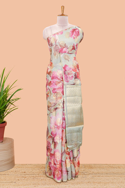 Green kota silk saree with zari butta and digital floral print pallu