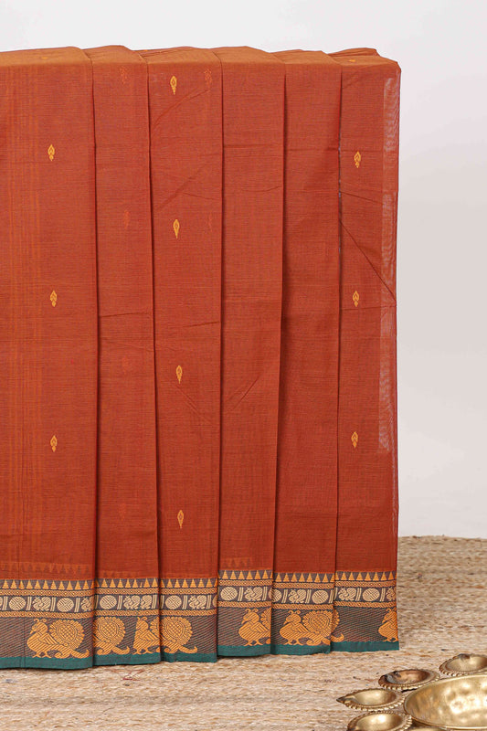 Rust orange zari butta chettinad cotton saree with contrast bird design border and striped pallu