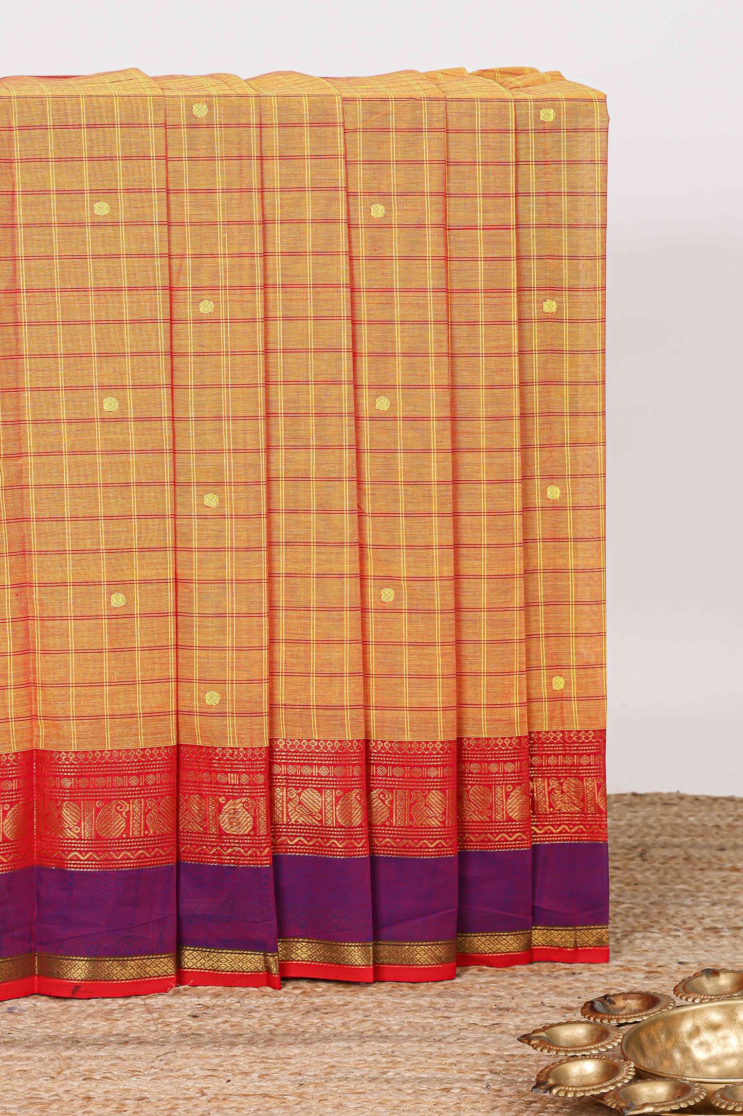 Orange checked zari butta chettinad cotton saree with contrast zari border and striped pallu