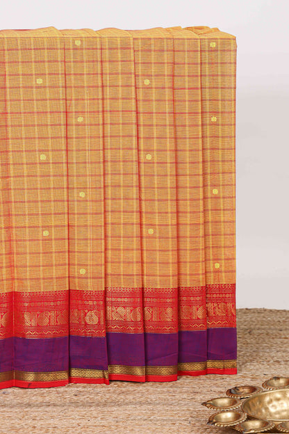 Orange checked zari butta chettinad cotton saree with contrast zari border and striped pallu